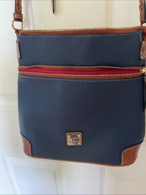 Dooney & Bourke Navy Crossbody with Brown Trim and Red Zip Accent damaged
